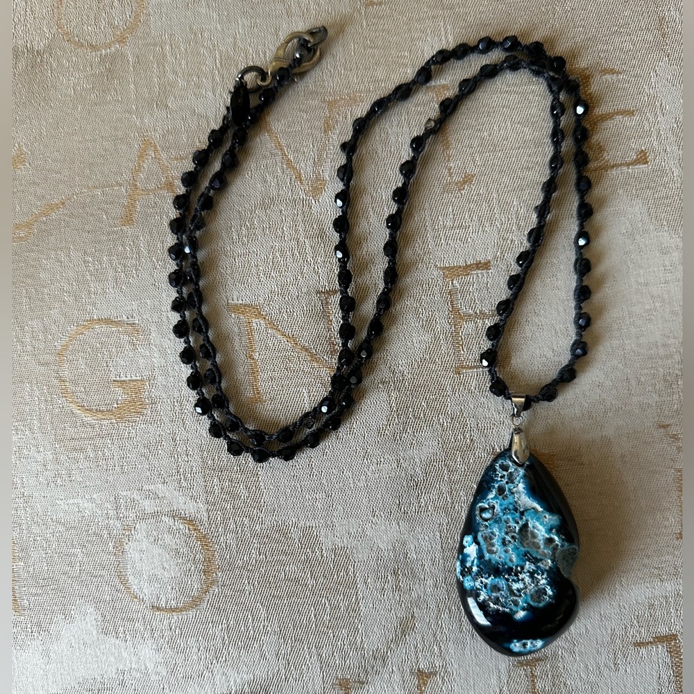 NWOT Hand made crochet chain with polished black, blue, and white stone.